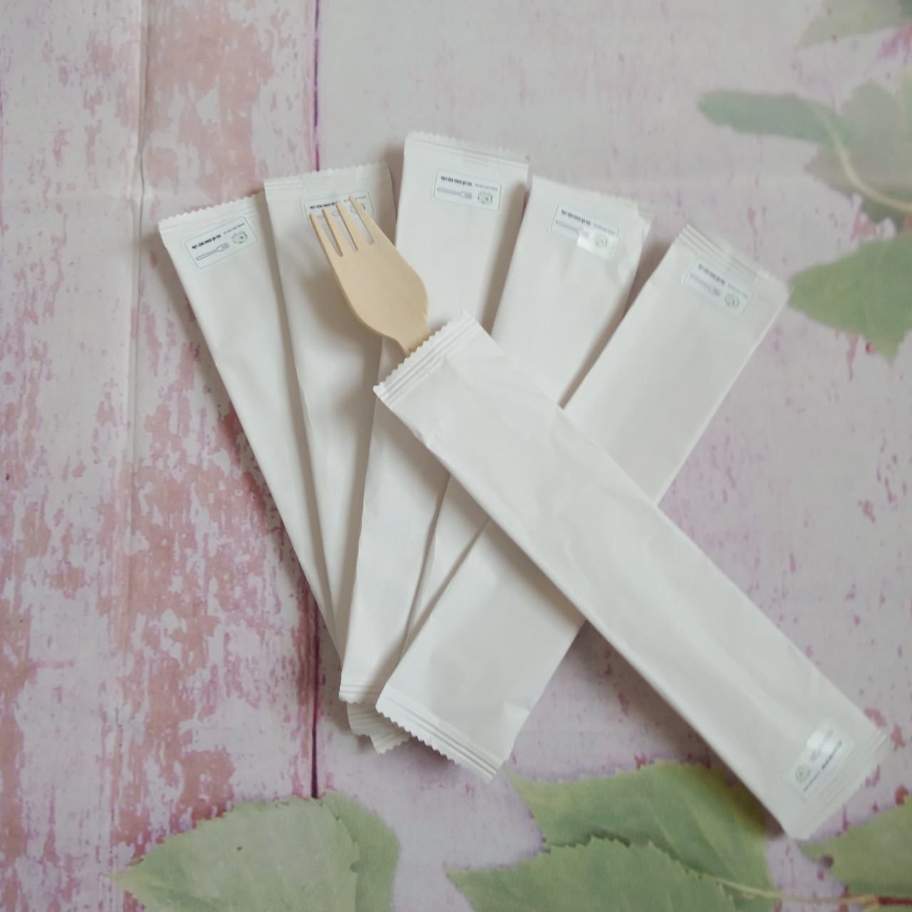 Paper wrapped disposable wooden fork